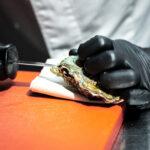 Closeup shot of a chef cutting the oyster